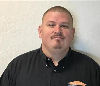 SERVPRO employee in front of white background