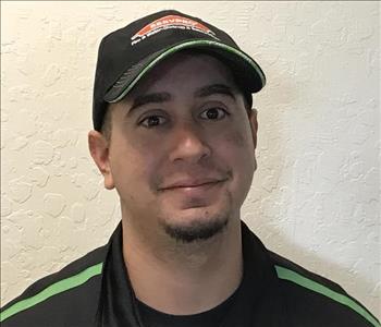 SERVPRO employee in front of white background