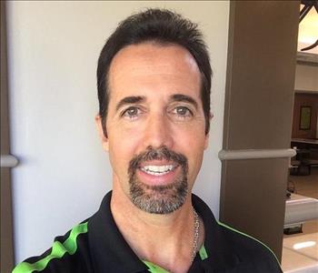SERVPRO employee in front of white background