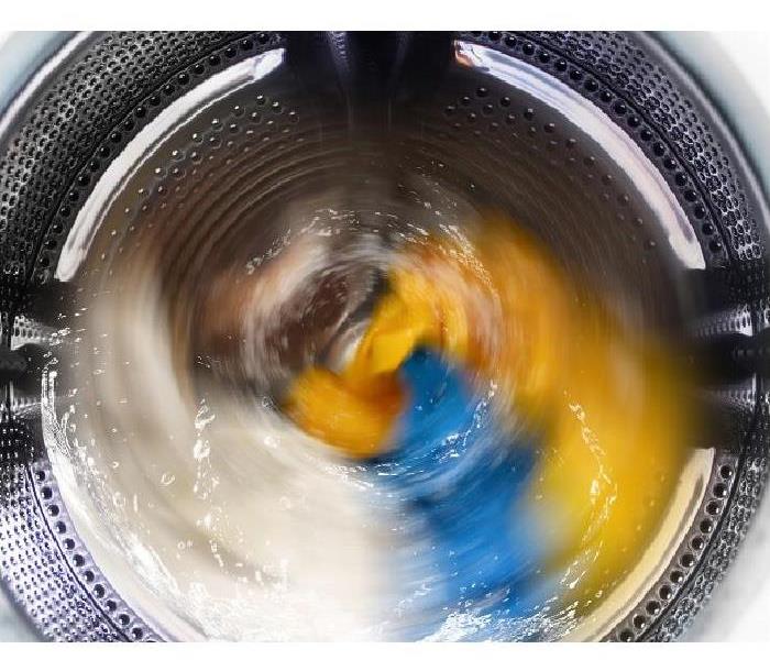 clothes in washing machine during spin cycle