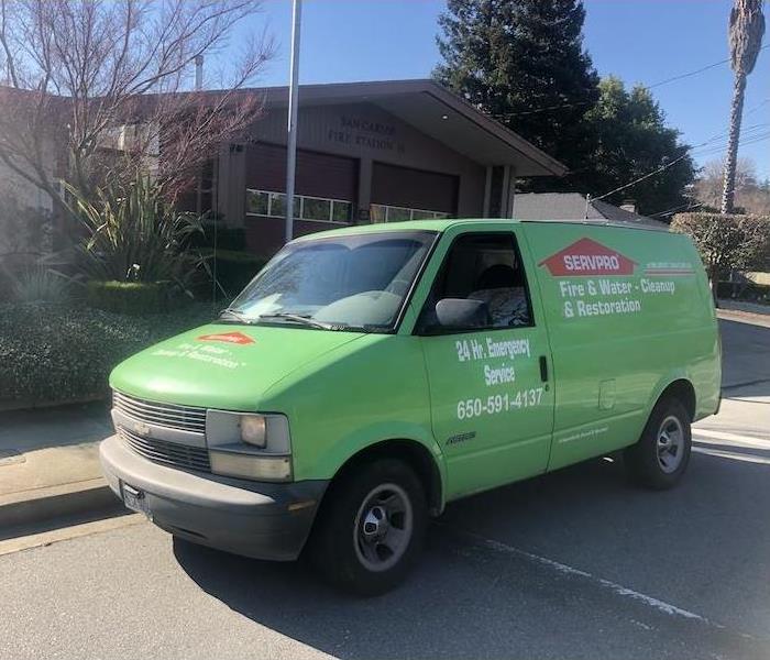 SERVPRO vehicle outside fire station.