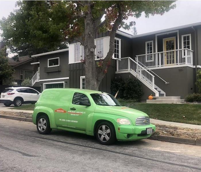 SERVPRO vehicle outside job site.